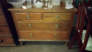 A oak chest of 4 drawers