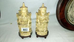 A pair of Oriental figurines