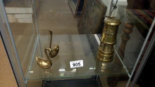 A brass miners lamp and pair of brass swans