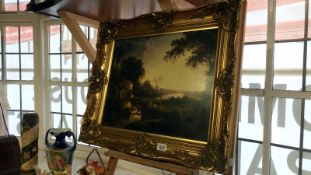 A gilt framed picture of a mill