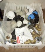 A crate of brass taps, plastic fittings etc