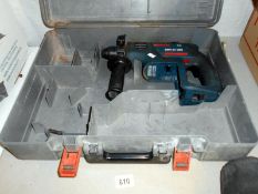 A Bosch hammer drill with charger and battery