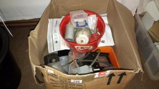 A box of various plumbing fittings and electrical pumps etc