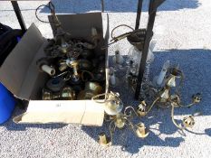 A quantity of chandeliers and oil lamp parts