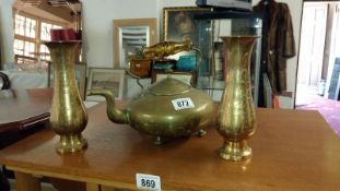 A brass kettle and 3 brass urns