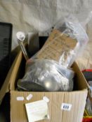 A box of electrical items including lighting, shower unit etc