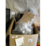 A box of electrical items including lighting, shower unit etc