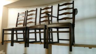 A set of 4 leather back chairs