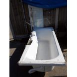 A bath with side panel