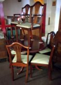 A table and 6 chairs including 2 carvers