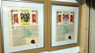 A pair of framed and glazed heraldic pictures