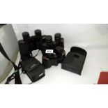 4 pairs of binoculars and a camera