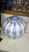 A large blue and white pumpkin pot