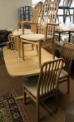 A good quality beech extending table and 8 chairs