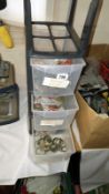 A cabinet of brass clips etc