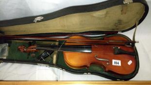 A violin in case with 2 bows
