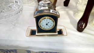 A Royal Doulton porcelain clock and tray