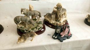 2 wolf figurines and 2 others