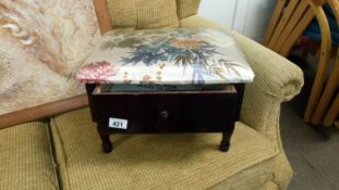 A sewing stool and drawer