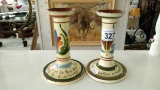 A pair of Watcombe candlesticks