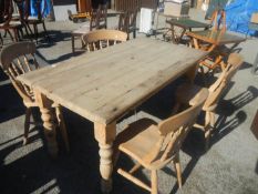 A antique pine table and 4 chairs