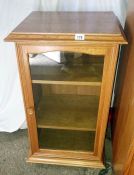 An oak veneere display cabinet