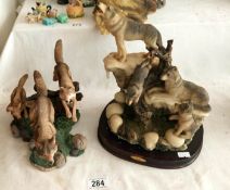 2 wolf figurines