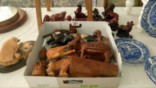 A quantity of wooden and resin figures