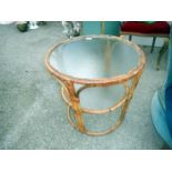 A glass topped round bamboo table