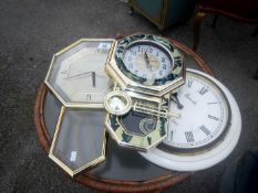 A quartz wall clock and 2 other clocks