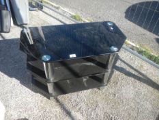 A black glass TV stand