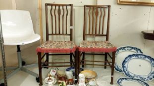 A matching pair of bedroom chairs