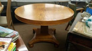 A large round oak dining table