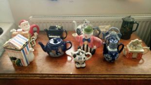 A quantity of approx 12 collectors teapots etc