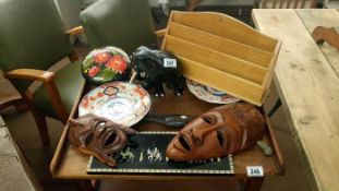 A quantity of tribal masks, Imari plates etc