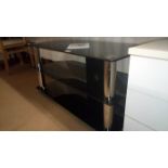 A large glass black TV stand