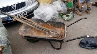 A wheelbarrow & tools