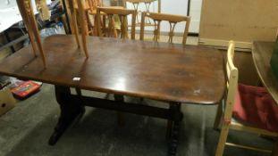 A refectory style table and chairs