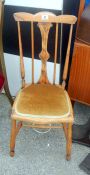 A inlaid spindle back chair