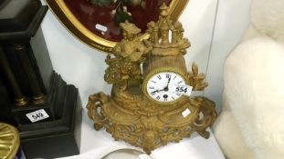 A spelter clock surmounted minstrell