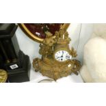 A spelter clock surmounted minstrell