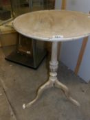 A shabby chic tripod table