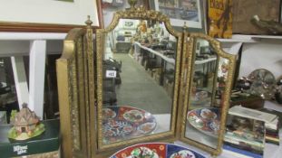 A dressing table triple mirror