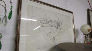 A pencil drawing of a reclining nude by Lewis Davies (1939 - 2010) signed in pencil,