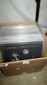 A box of approximately 60 progressive & classic rock LP records, including Bob Dylan, The Beatles,