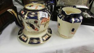 An old imari pattern teapot and jug