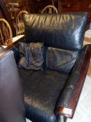A mahogany framed arm chair with quilted leather back and sides. From Harrods