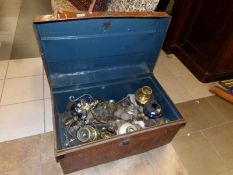 A tin trunk full of oil lamp parts etc