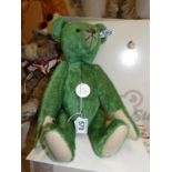 A boxed Steiff 1908 green teddy bear,