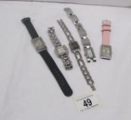 5 wristwatches including Gucci,